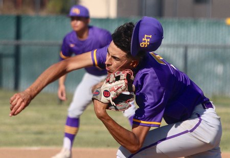 Lemoore's Anfernee Murrieta loses his hat as he pitches in the first inning in Wednesday's 9-3 win over Hanford.